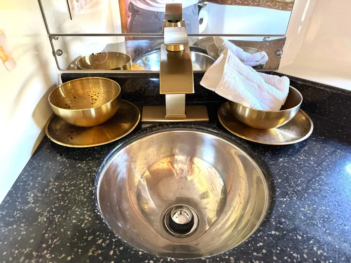 Craver Yacht Photos Pics Luxury bathroom sink with brass fixtures on a 2001 Carver 396 Motor Yacht.