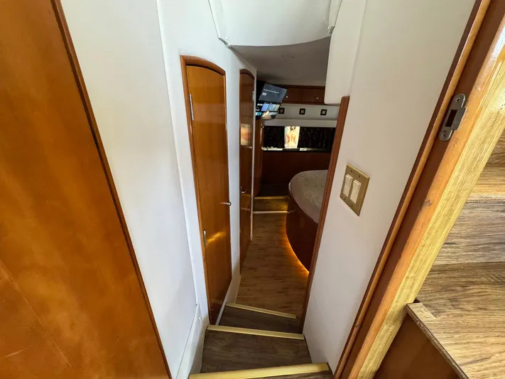 Craver Yacht Photos Pics Interior hallway of 2001 Carver 396 Motor Yacht with wooden doors and steps.