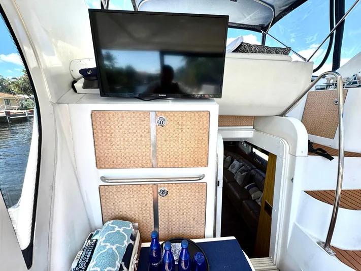 Craver Yacht Photos Pics 2001 Carver 396 Motor Yacht interior with TV, cabinets, and stairs.