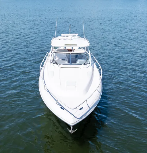 Lil' Sumpin II Yacht Photos Pics 2015 Intrepid 430 Sport Yacht on calm blue water, front view.