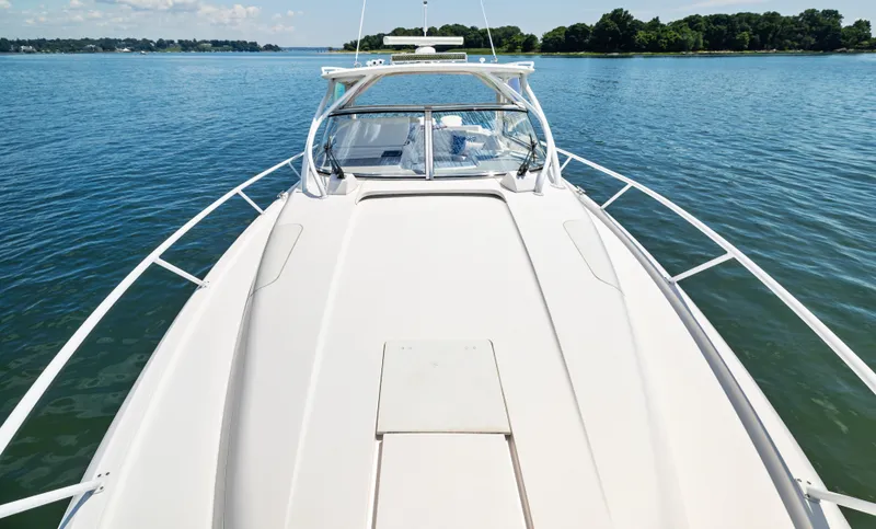 Lil' Sumpin II Yacht Photos Pics 2015 Intrepid 430 Sport Yacht on calm water, showcasing sleek deck design.