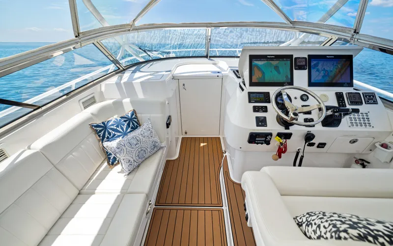 Lil' Sumpin II Yacht Photos Pics 2015 Intrepid 430 Sport Yacht cockpit with plush seating and advanced navigation systems.