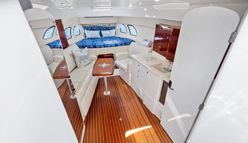 Lil' Sumpin II Yacht Photos Pics Luxurious interior of 2015 Intrepid 430 Sport Yacht with elegant seating and cozy bed.