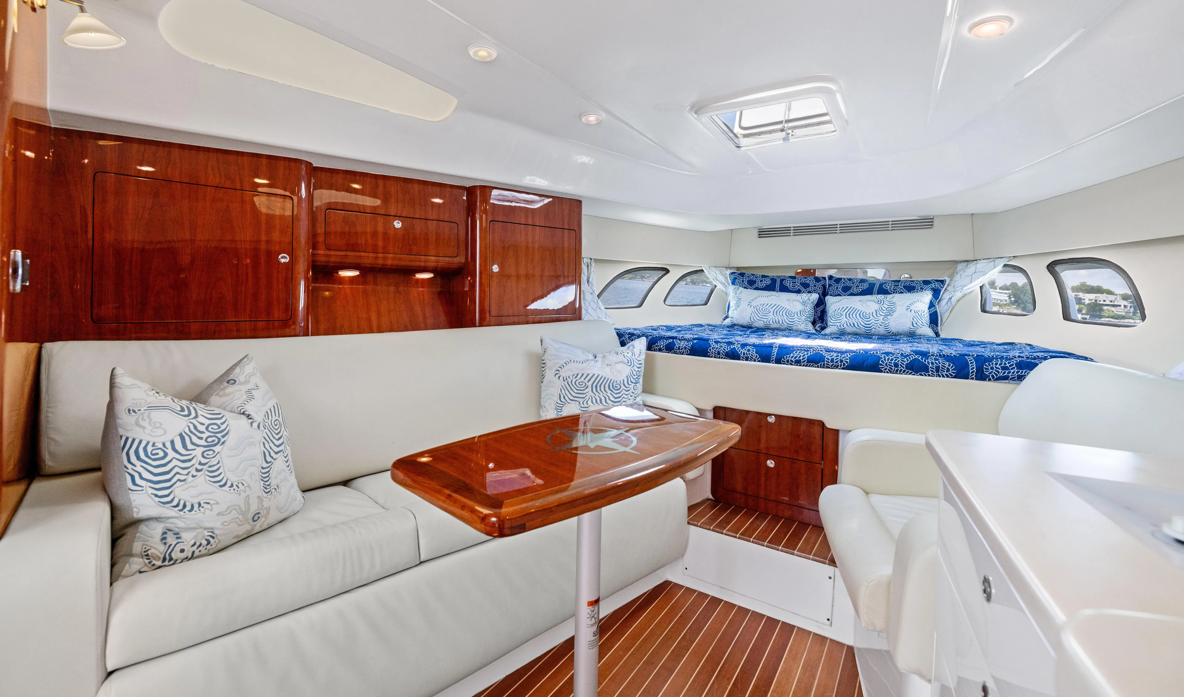 Lil' Sumpin II Yacht Photos Pics Luxurious interior of 2015 Intrepid 430 Sport Yacht with elegant seating and bedding.