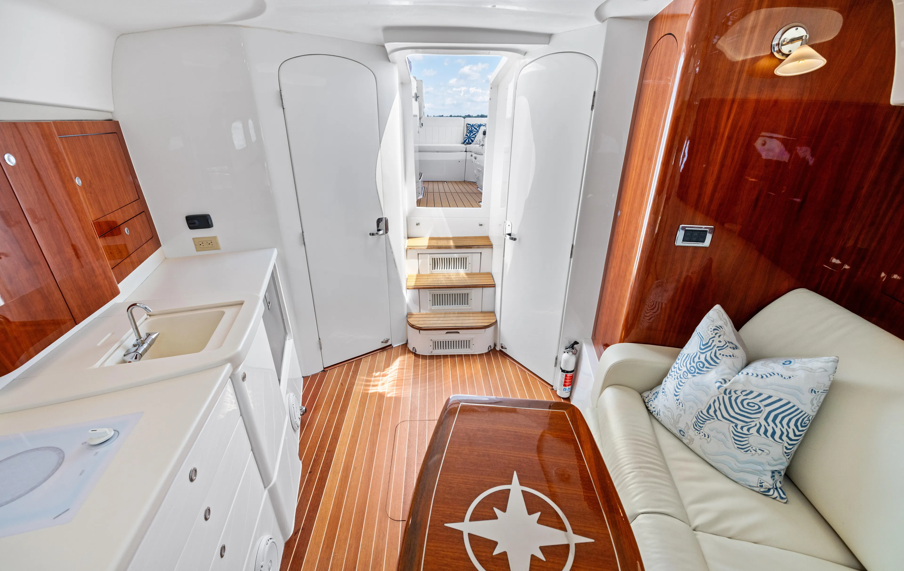 Lil' Sumpin II Yacht Photos Pics Luxurious interior of 2015 Intrepid 430 Sport Yacht with elegant wood finishes and plush seating.