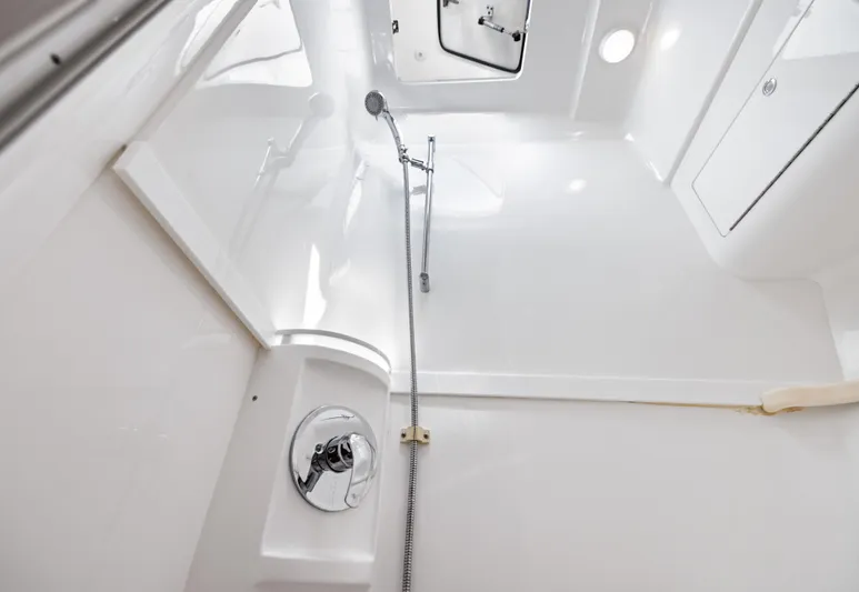 Lil' Sumpin II Yacht Photos Pics 2015 Intrepid 430 Sport Yacht shower area with sleek, modern design and chrome fixtures.