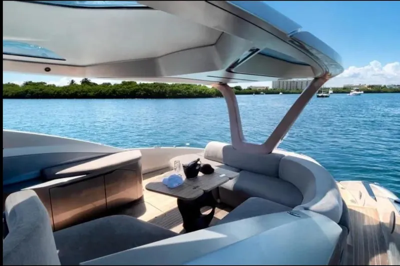 Lamborghini Tecnomar Yacht Photos Pics Luxurious Tecnomar 55 Evo yacht interior with elegant seating, overlooking serene blue waters.