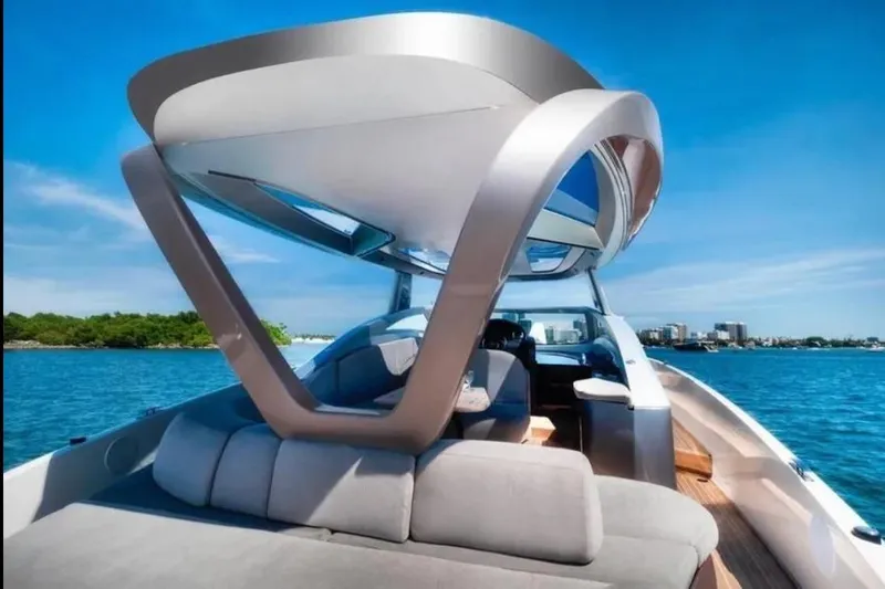 Lamborghini Tecnomar Yacht Photos Pics Luxury Tecnomar 55 Evo yacht on blue water, showcasing sleek design and modern architecture.