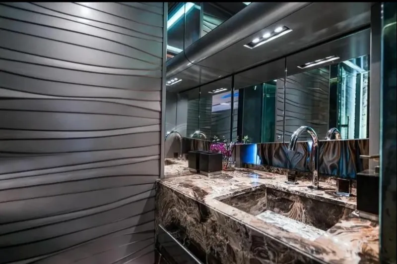 Lamborghini Tecnomar Yacht Photos Pics Luxurious bathroom interior on Tecnomar 55 Evo yacht, featuring marble sink and modern fixtures.