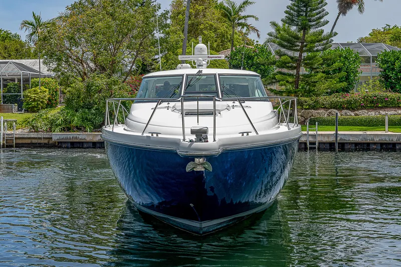 Second Chance II Yacht Photos Pics 2007 Tiara Yachts 4300 Sovran docked, front view with lush greenery background.