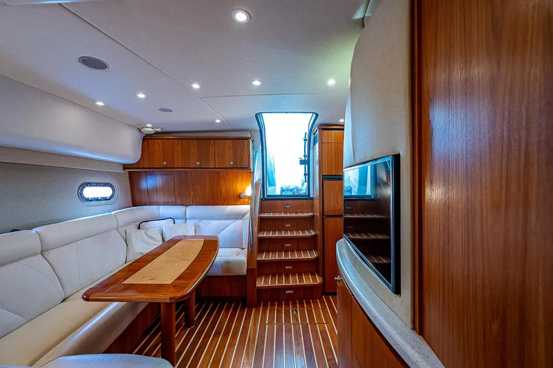 Second Chance II Yacht Photos Pics Luxurious interior of 2007 Tiara Yachts 4300 Sovran with wood finishes and plush seating.
