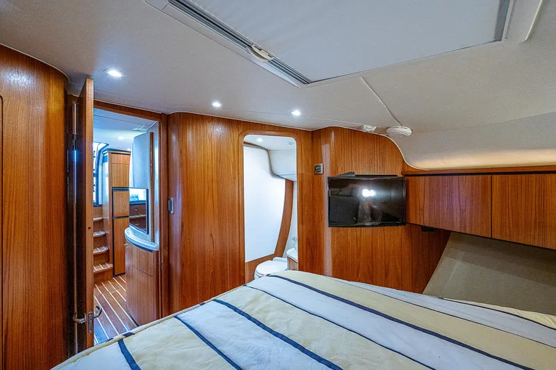 Second Chance II Yacht Photos Pics 2007 Tiara Yachts 4300 Sovran cabin interior with wood paneling and modern amenities.