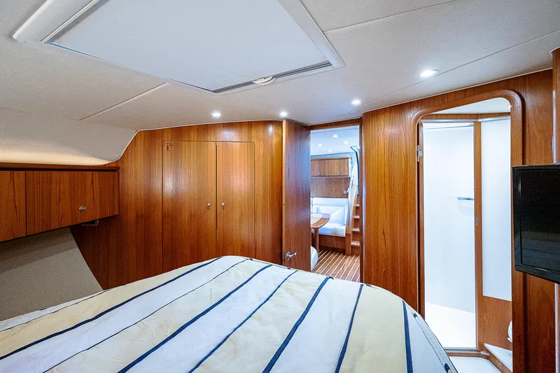 Second Chance II Yacht Photos Pics Interior of 2007 Tiara Yachts 4300 Sovran, featuring wood paneling and cozy cabin space.