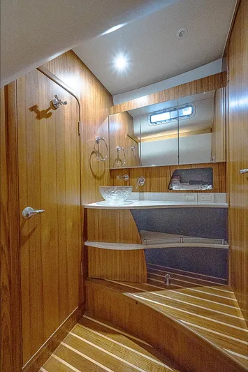 Second Chance II Yacht Photos Pics 2007 Tiara Yachts 4300 Sovran bathroom with wooden interior and modern fixtures.