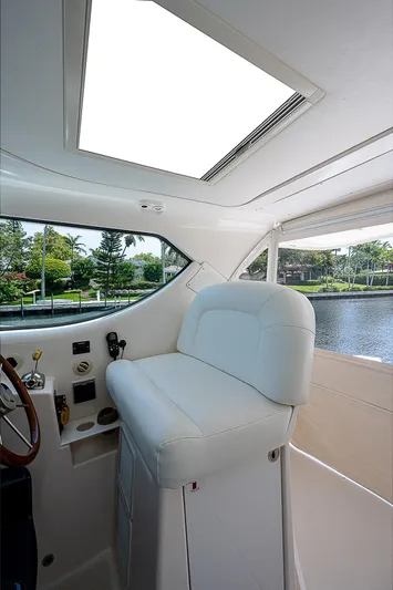 Second Chance II Yacht Photos Pics 2007 Tiara Yachts 4300 Sovran interior with helm seat and water view.