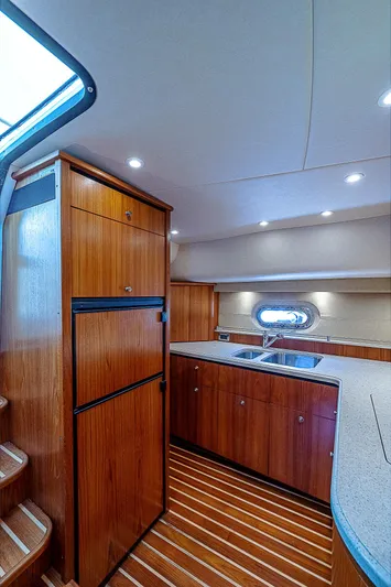 Second Chance II Yacht Photos Pics 2007 Tiara Yachts 4300 Sovran interior with wood cabinetry and modern kitchen design.