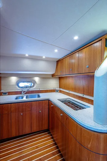 Second Chance II Yacht Photos Pics 2007 Tiara Yachts 4300 Sovran galley with wood cabinetry and modern appliances.