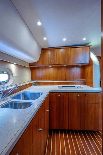 Second Chance II Yacht Photos Pics 2007 Tiara Yachts 4300 Sovran kitchen with wooden cabinets and dual sinks.