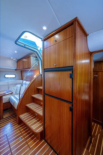 Second Chance II Yacht Photos Pics 2007 Tiara Yachts 4300 Sovran interior with wooden cabinetry and seating area.