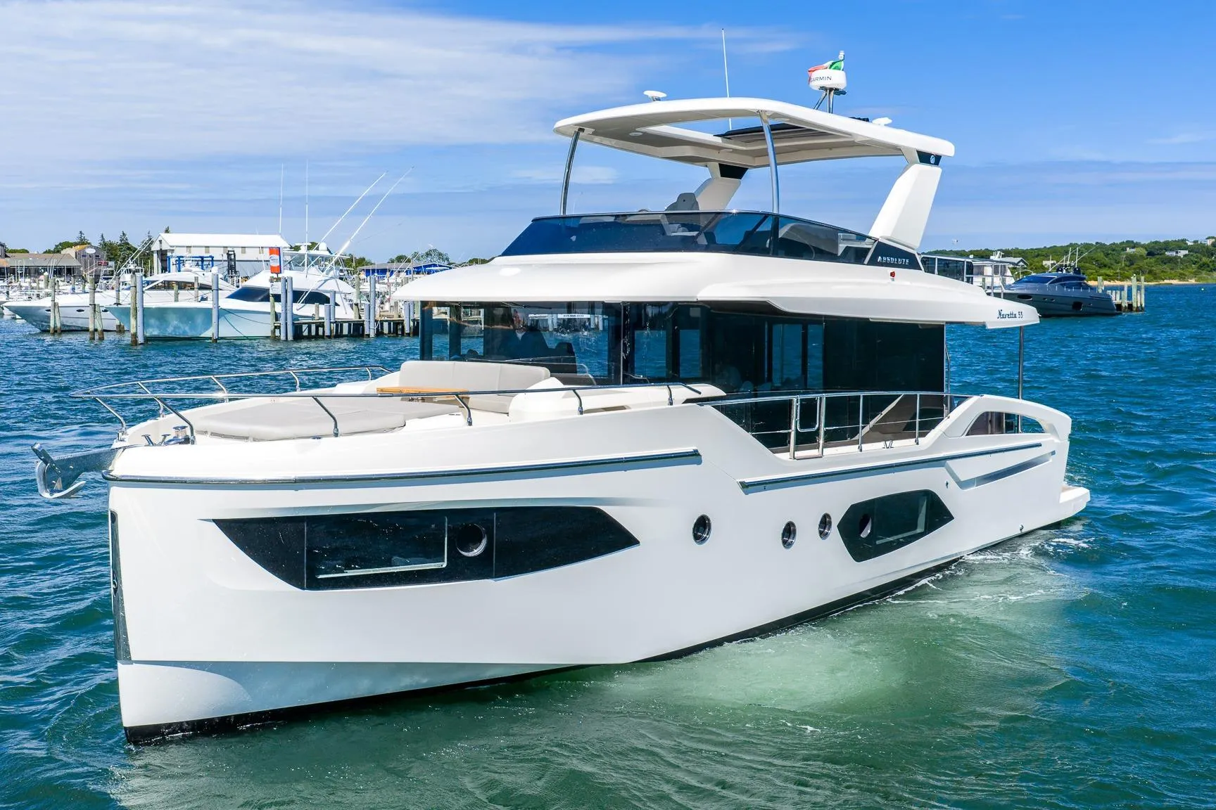 Luxury Absolute Navetta 53 yacht cruising in clear blue waters, 2026 model.