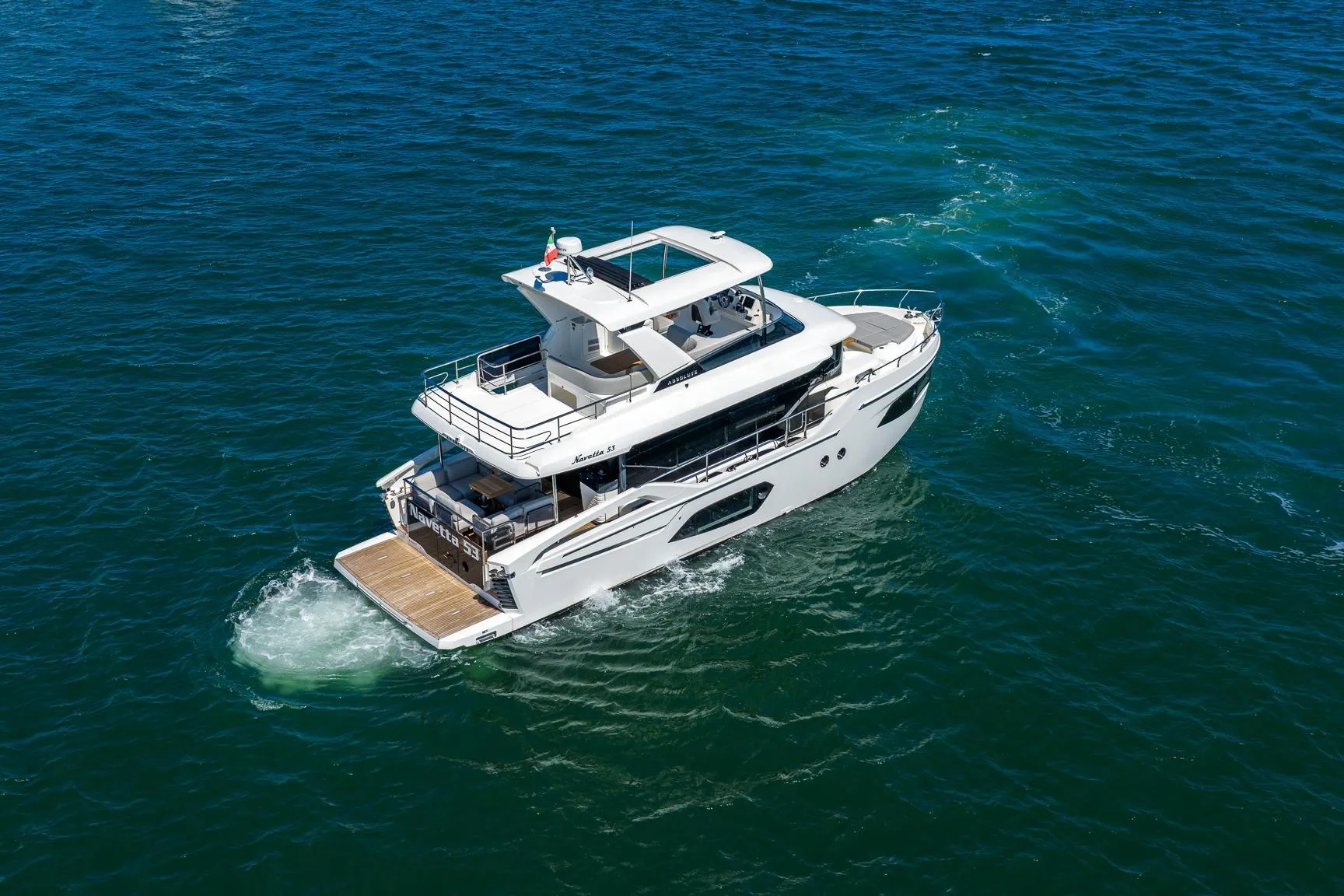 2026 Absolute Navetta 53 yacht cruising on open blue waters.