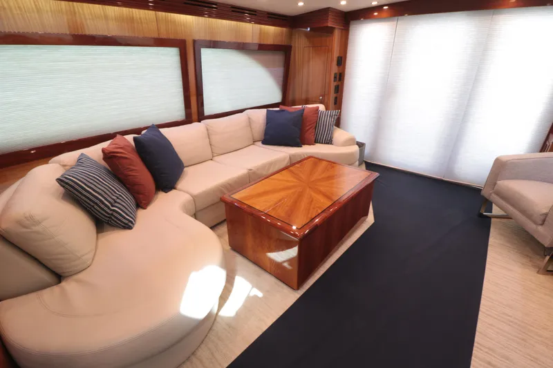  Yacht Photos Pics Luxurious 2007 Hatteras 64 Motor Yacht interior with plush seating and elegant wood accents.