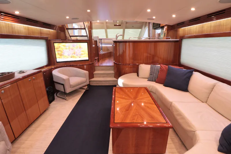  Yacht Photos Pics Luxurious interior of 2007 Hatteras 64 Motor Yacht with elegant wood finishes.