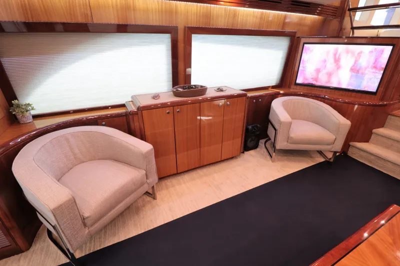  Yacht Photos Pics Luxurious interior of 2007 Hatteras 64 Motor Yacht with elegant seating and cabinetry.