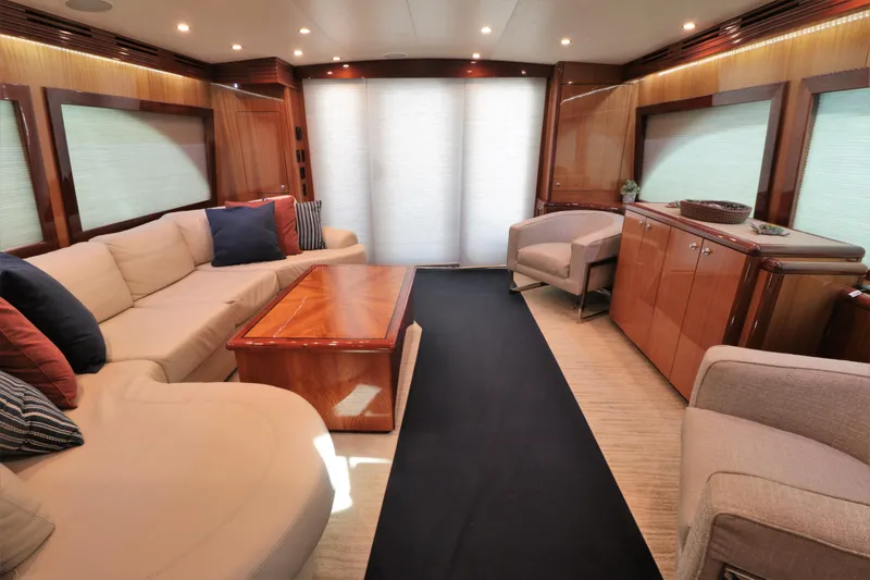  Yacht Photos Pics Luxurious interior of 2007 Hatteras 64 Motor Yacht with elegant seating and wood finishes.