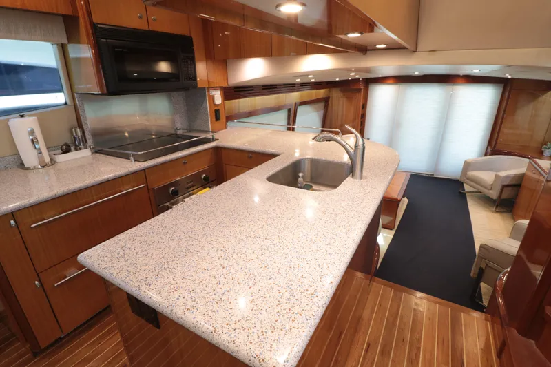  Yacht Photos Pics Luxurious kitchen interior of 2007 Hatteras 64 Motor Yacht with modern amenities.