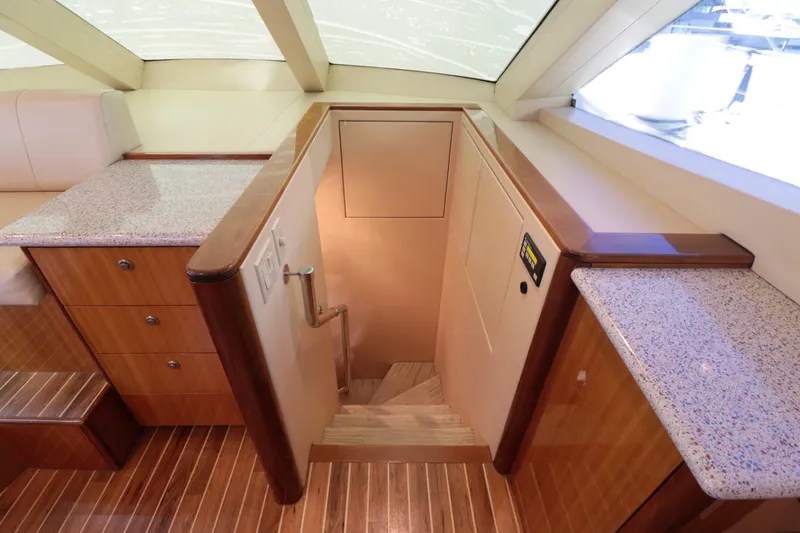  Yacht Photos Pics Interior of 2007 Hatteras 64 Motor Yacht with wooden stairs and countertops.