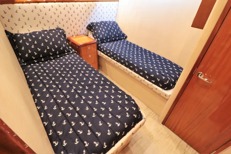  Yacht Photos Pics Twin cabin with anchor-themed bedding on 2007 Hatteras 64 Motor Yacht.