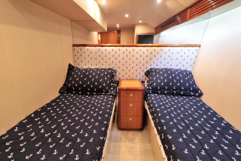  Yacht Photos Pics Twin cabin with anchor-themed bedding on 2007 Hatteras 64 Motor Yacht.