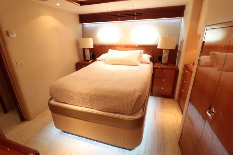  Yacht Photos Pics Luxurious bedroom interior of 2007 Hatteras 64 Motor Yacht with elegant lighting.