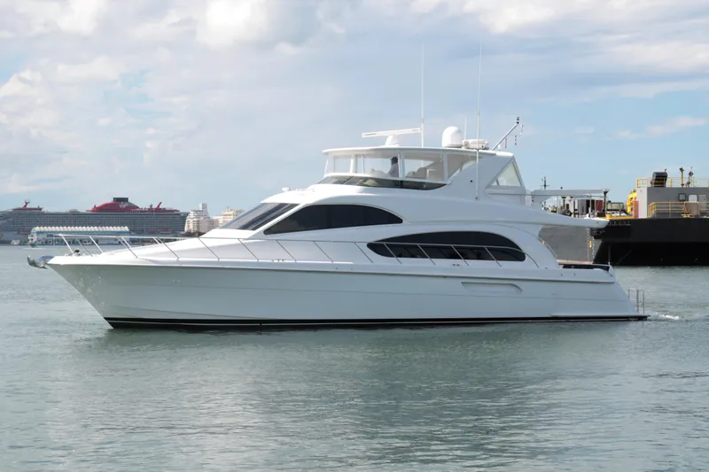  Yacht Photos Pics 2007 Hatteras 64 Motor Yacht cruising on calm waters.