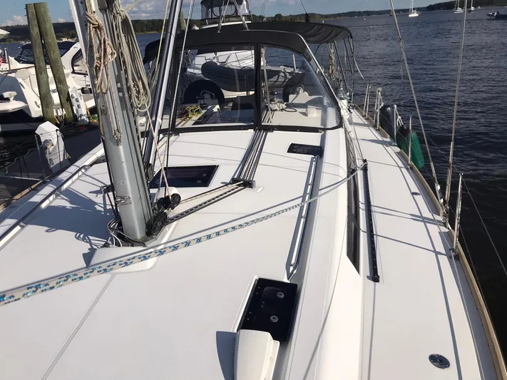 Jinbei Yacht Photos Pics 2014 Beneteau Oceanis 48 sailboat docked, showcasing sleek deck design and rigging.