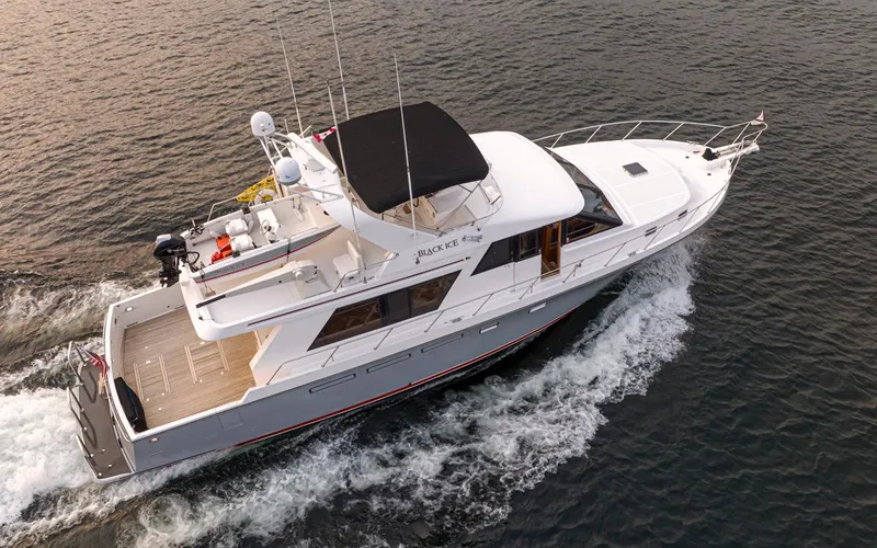 Black Ice Yacht Photos Pics 1998 Ocean Alexander 64 yacht cruising on the water.