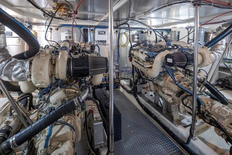 Black Ice Yacht Photos Pics Engine room of a 1998 Ocean Alexander 64 yacht with twin engines and mechanical systems.