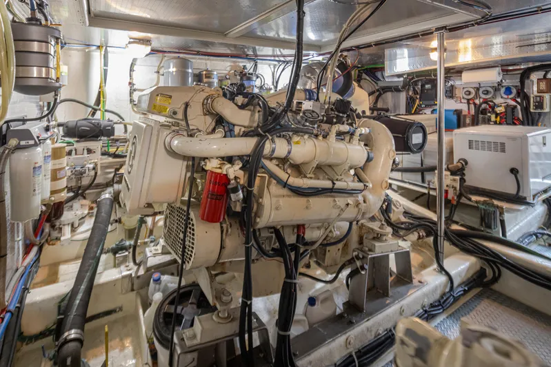 Black Ice Yacht Photos Pics Engine room of a 1998 Ocean Alexander 64 yacht with visible machinery and equipment.