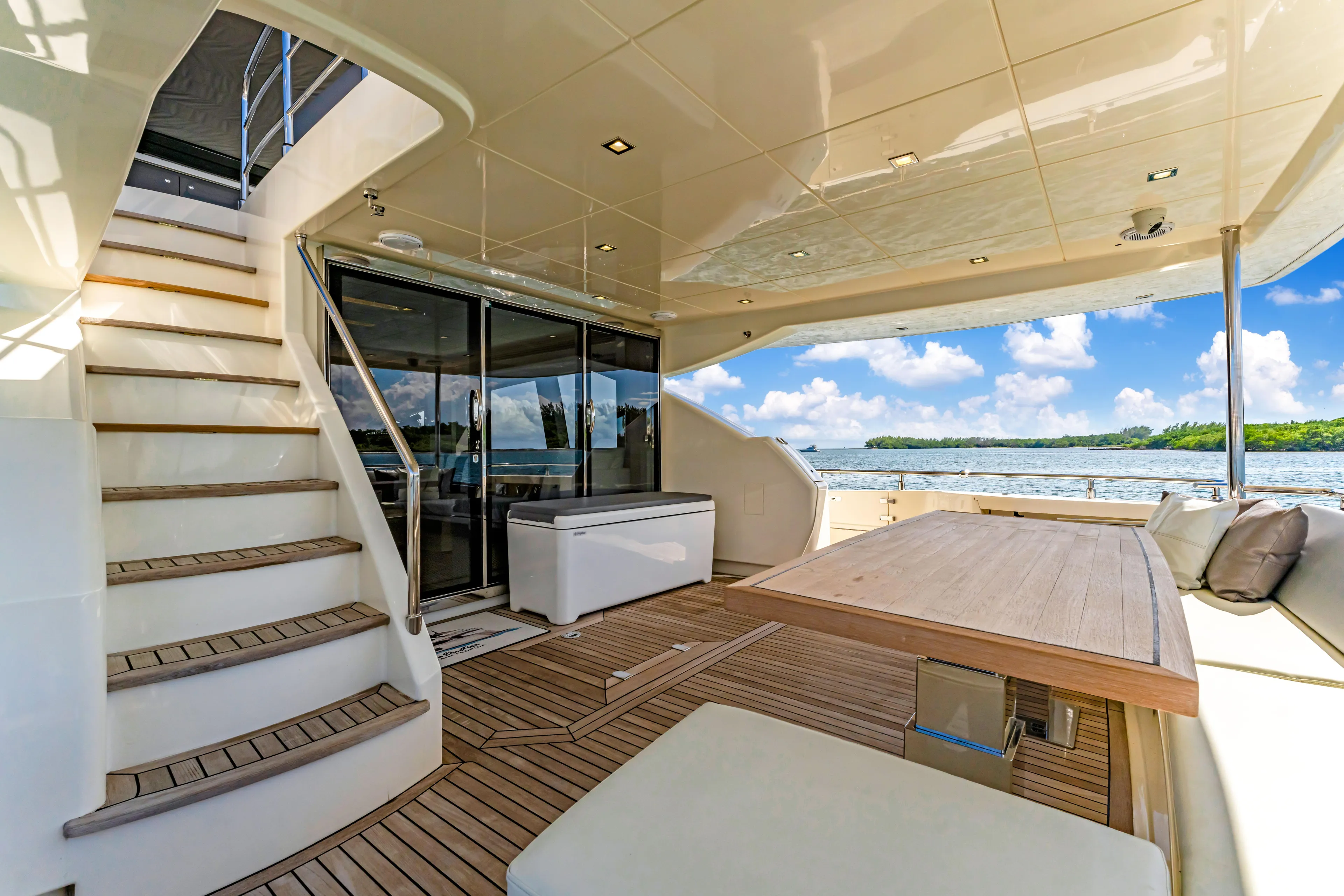 Seaduction Yacht Photos Pics Luxurious 2016 Astondoa 80 GLX yacht deck with elegant seating and scenic ocean view.