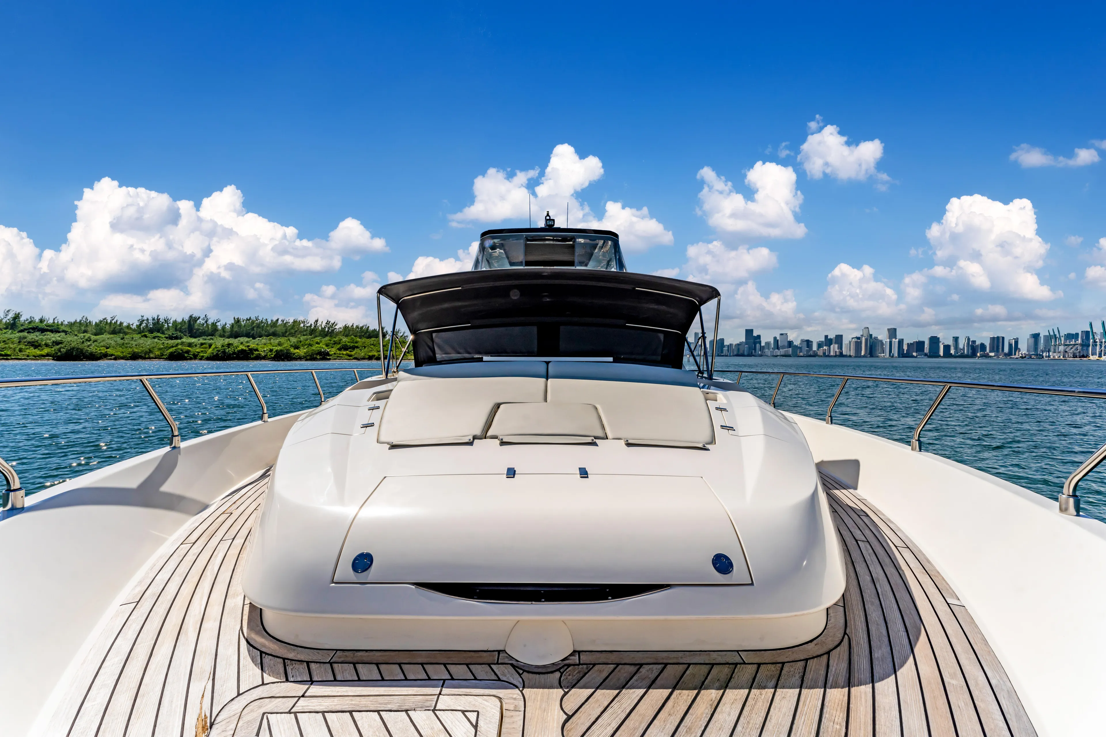 Seaduction Yacht Photos Pics Luxury Astondoa 80 GLX yacht on open water, 2016 model, with city skyline backdrop.