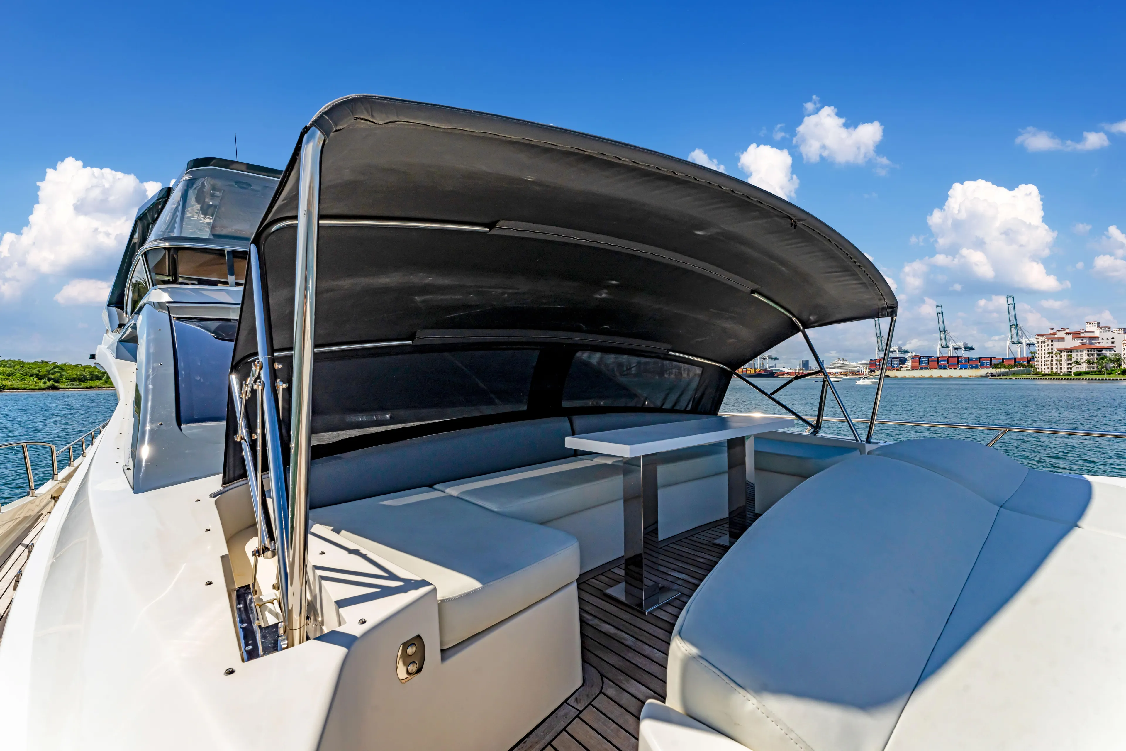 Seaduction Yacht Photos Pics Luxury Astondoa 80 GLX yacht deck with seating, 2016 model, under a sunny sky.