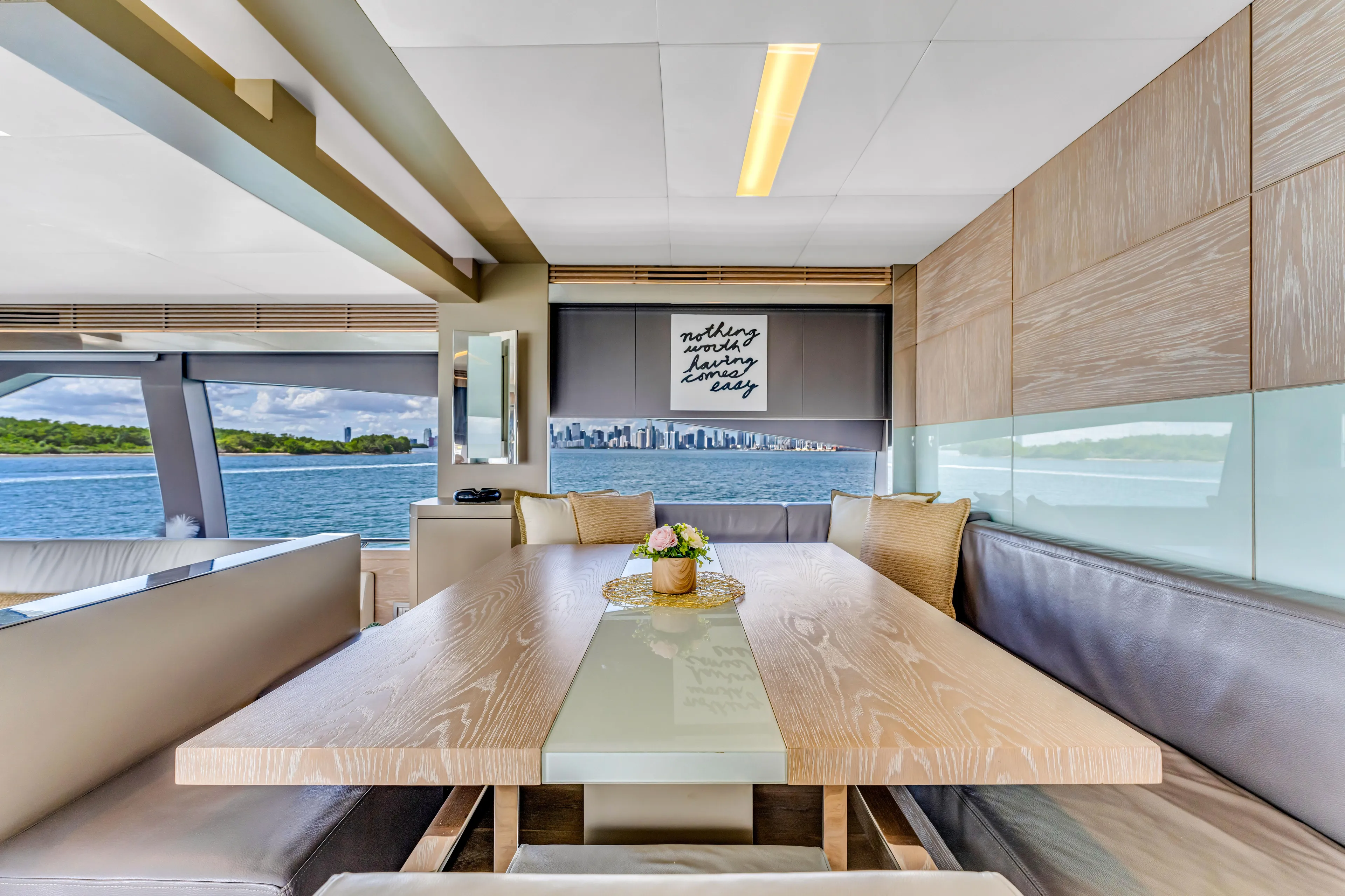 Seaduction Yacht Photos Pics Luxurious interior of 2016 Astondoa 80 GLX yacht with elegant dining area and scenic view.