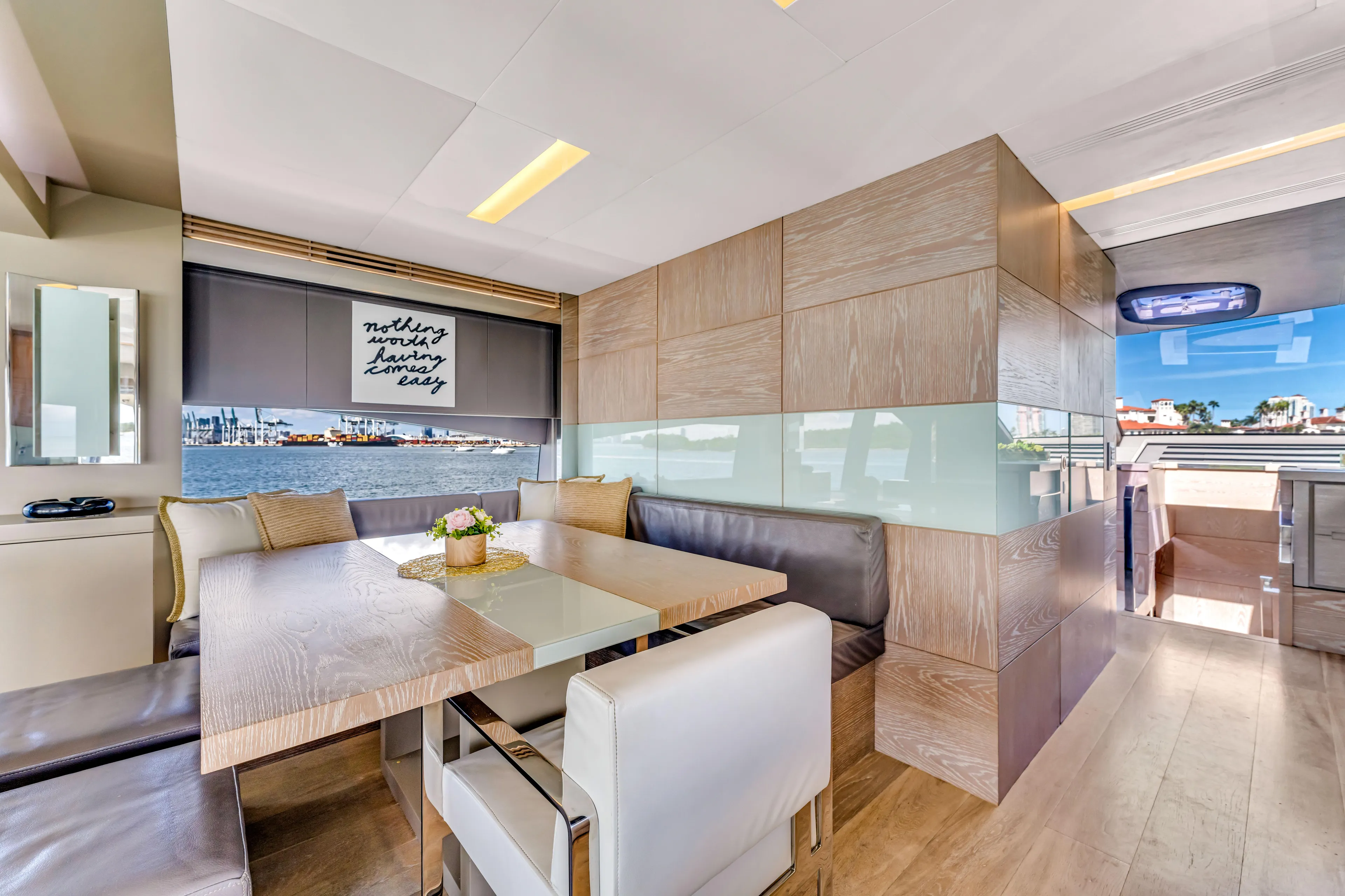 Seaduction Yacht Photos Pics Luxurious interior of 2016 Astondoa 80 GLX yacht with elegant dining area and waterfront view.