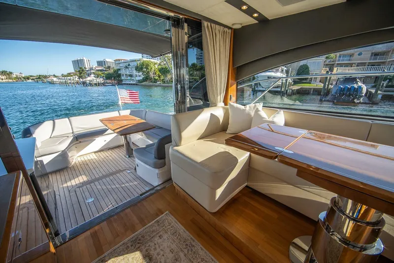 Sea-licious Yacht Photos Pics Luxurious 2016 Princess V48 yacht interior with elegant seating and scenic waterfront view.