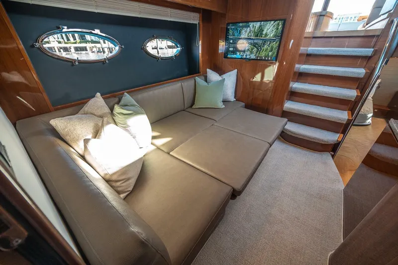 Sea-licious Yacht Photos Pics Luxurious interior of 2016 Princess V48 yacht with plush seating and elegant decor.