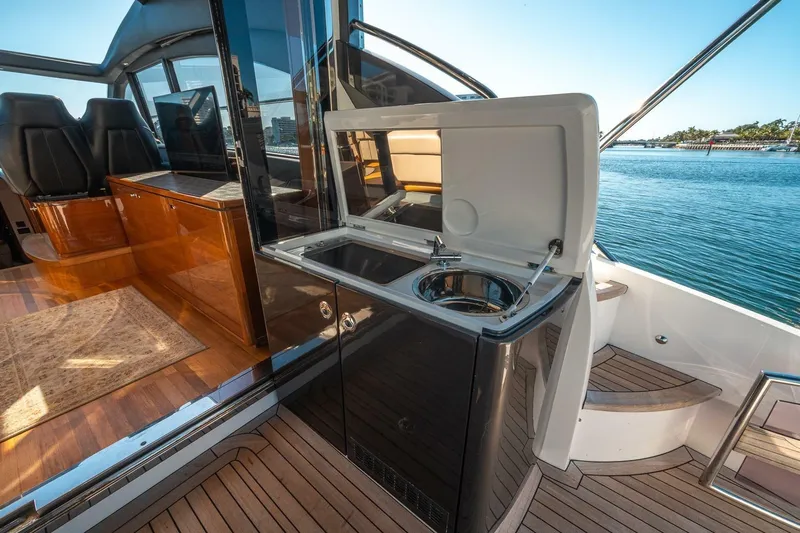 Sea-licious Yacht Photos Pics Luxury 2016 Princess V48 yacht interior with kitchenette and ocean view.