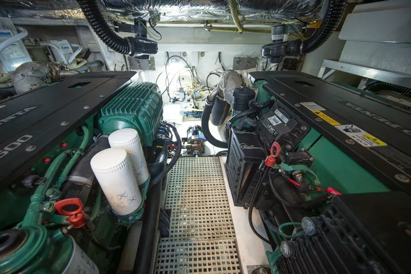 Sea-licious Yacht Photos Pics Engine room of a 2016 Princess V48 yacht, showcasing dual engines and mechanical components.