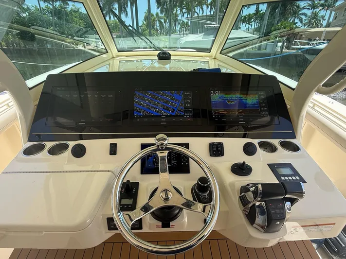 Reel Patience Yacht Photos Pics 2019 Scout 420 LXF helm with advanced navigation displays and controls.