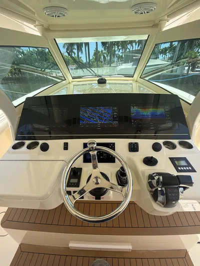 Reel Patience Yacht Photos Pics Helm of 2019 Scout 420 LXF boat with advanced navigation controls and displays.